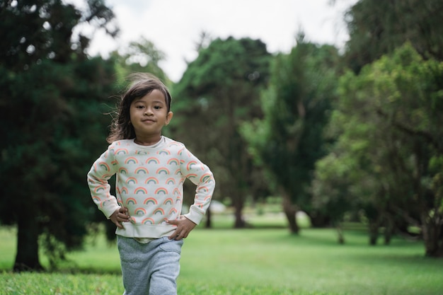 Cute young kid walking in the park