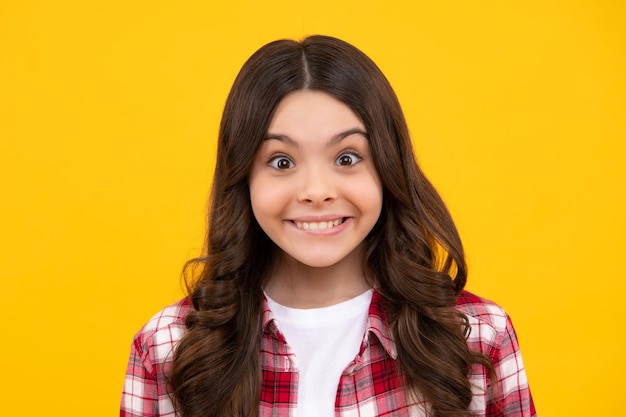 Cute young teenager girl against a isolated background Studio portrait of pretty beautiful child Happy teenager positive and smiling emotions of teen girl