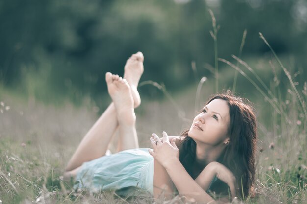 cute young woman enjoying a warm summer day. photo with copy space