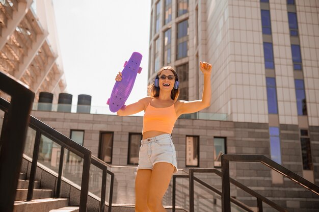 A cute young woman having good time outside on weekend