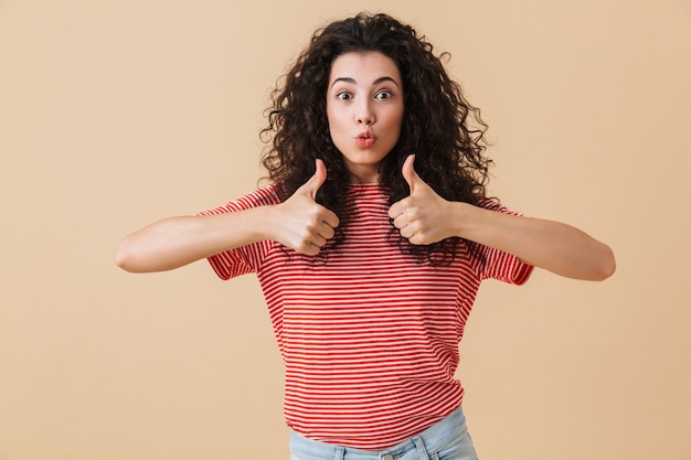 Cute young woman isolated showing thumbs up.