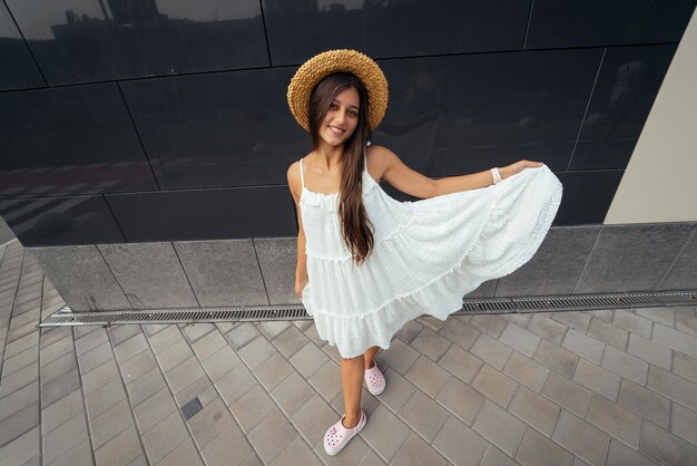 Cute young woman laughing at the camera