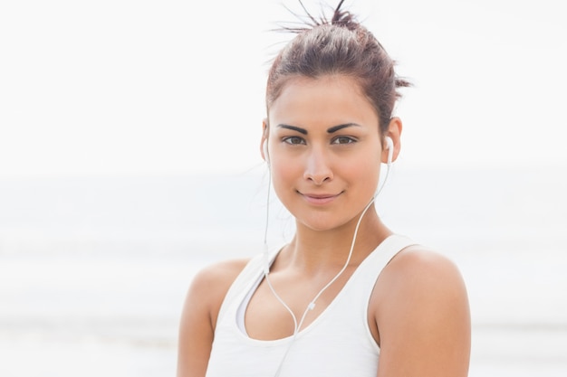 Cute young woman posing looking at camera