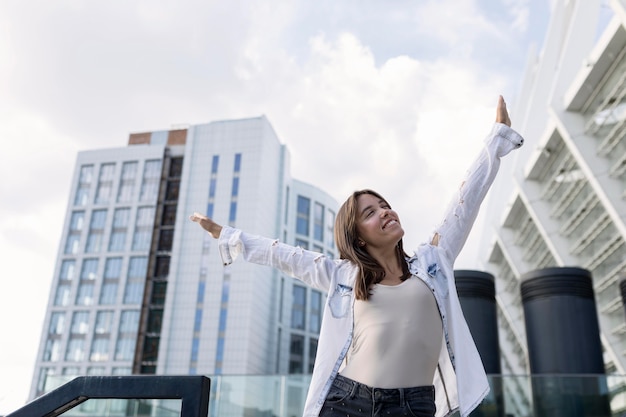 Cute young woman smiling outside