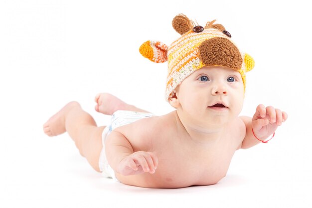 cutie little boy in white diaper and deer hat