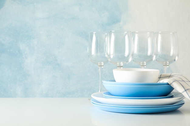 Cutlery beautifully stacked on white table against blue table