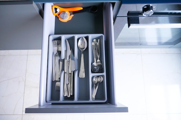 Cutlery fork with knife and spoon in a drawer