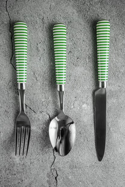 Cutlery on gray concrete background