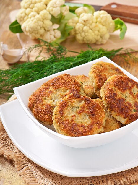 Cutlets cauliflower with fennel, garlic and cheese sauce