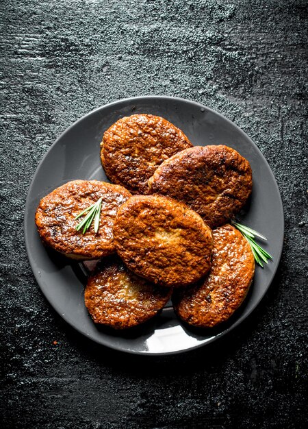 Cutlets on a plate with rosemary