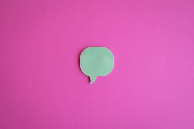 Cutout of a message icon on a pink background