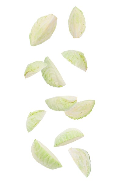 Cutted green cabbage falling isolated on white with clipping path.