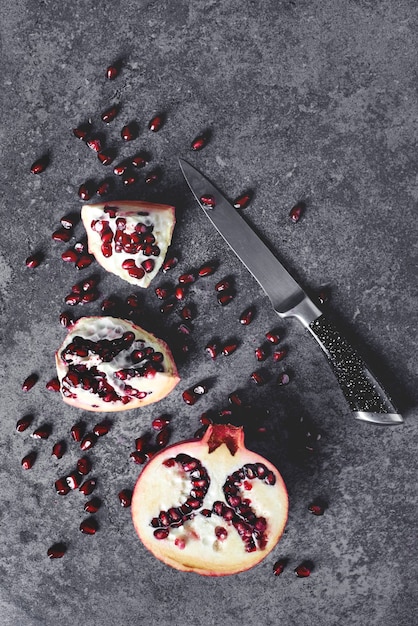 Cutted grenade with knife on the table