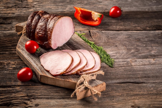 Cutted Ham Sausage on wooden background cold meats Food recipe background space for text top view