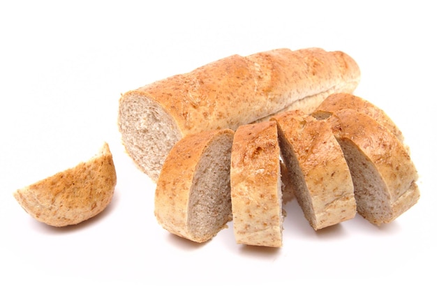 Cutted long loaf with bran on the white background