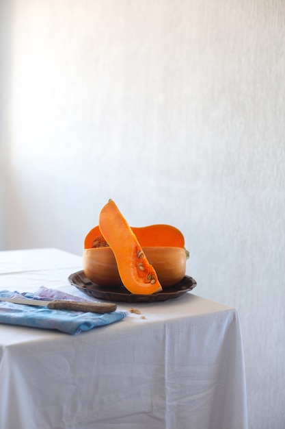 Cutted pumpkin on a white background, still life