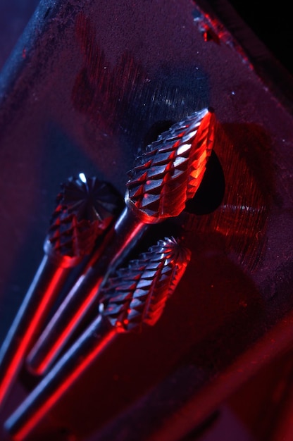 Cutters of tungsten carbide on the background of metal blanks CloseupxA