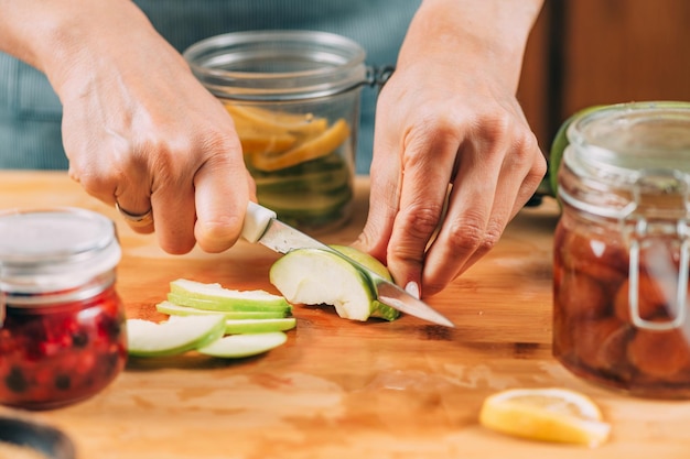 Photo cutting apple and lemon in the kitchen fruit fermentation