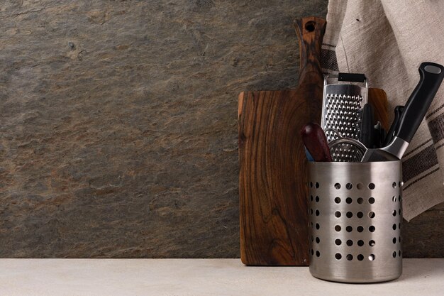 Cutting board and cutlery on wooden kitchen table