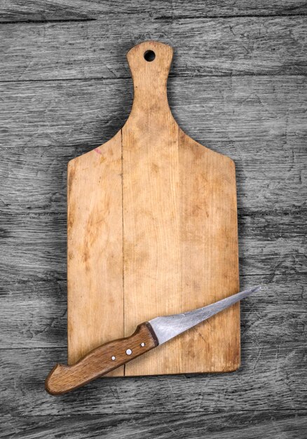 Cutting board and a kitchen knife on