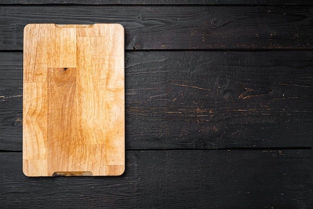 Photo cutting board set, on black wooden table background, top view flat lay , with copy space for text or your product