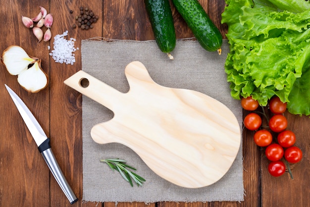 Cutting board in the shape of a guitar on a wooden table