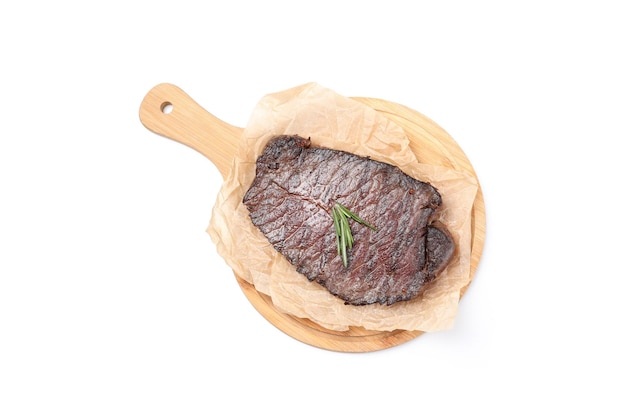 Cutting board with beef steak isolated on white background