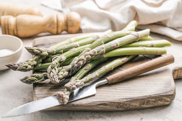 cutting board with fresh bunch of asparagus