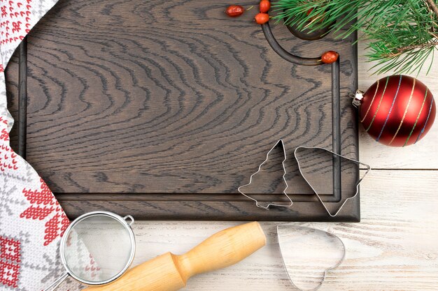 Cutting Board with kitchen accessories and Christmas toys.