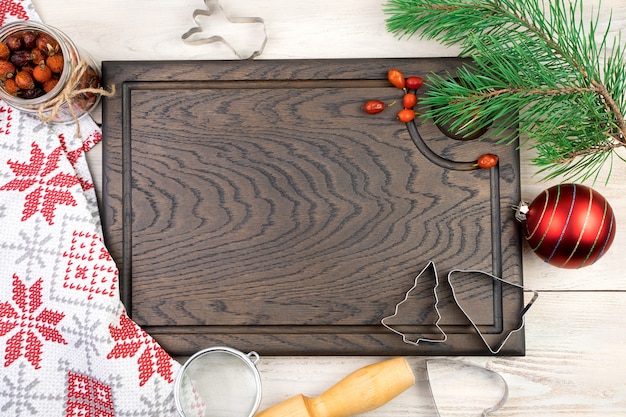 Cutting Board with kitchen accessories and Christmas toys.