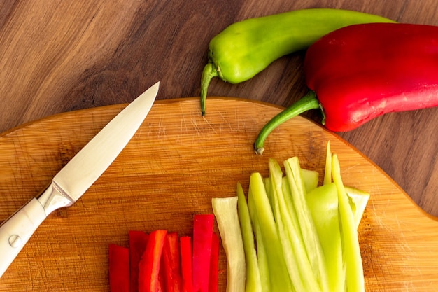 A cutting board with vegetables and knife for healthy cooking