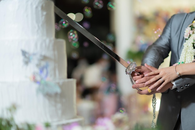 Cutting cake wedding couple hand together celebration