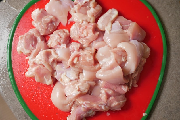 Cutting chicken fillet on a chopping board