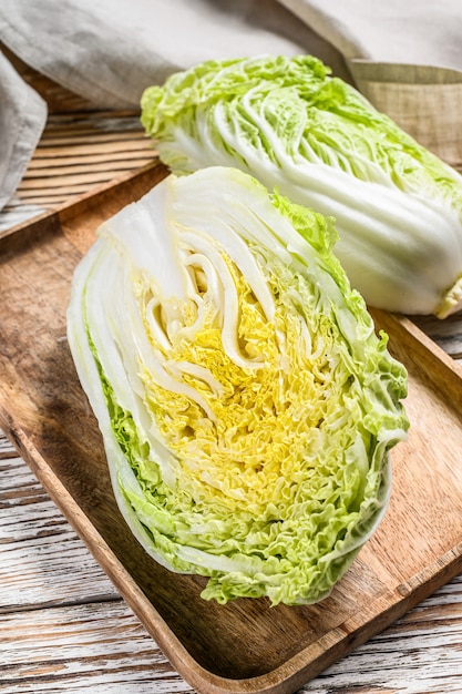 Cutting Chinese cabbage on wooden plate