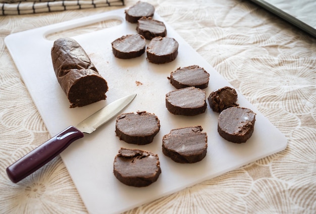 Cutting cookies for baking on a board