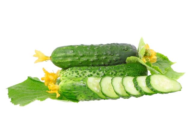 Cutting cucumbers on  with green leaf and yellow blossom cluster. Isolated over white.