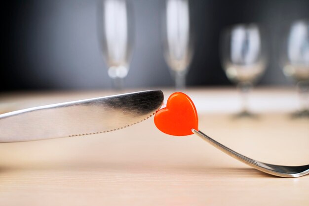 Cutting and eating a candy with fork and knife