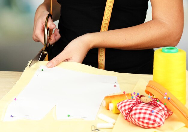 Cutting fabric with tailors scissors