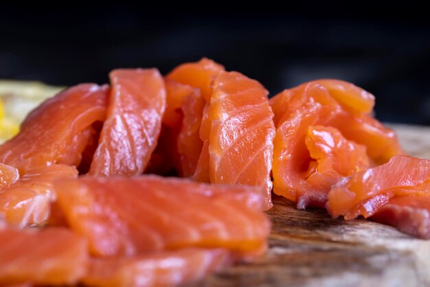 Cutting fish fillets during the preparation of a dish of red salmon fish