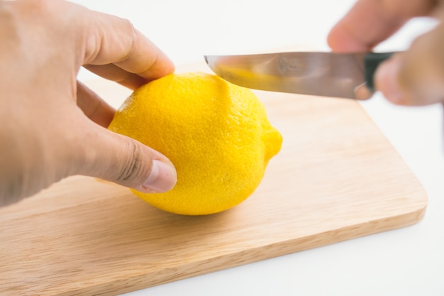 Cutting fresh lemon, fresh lemon