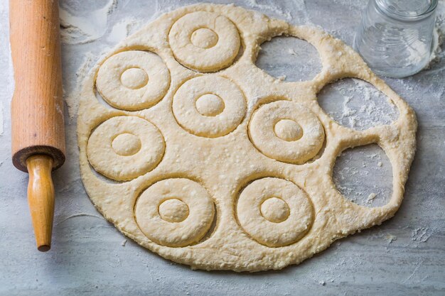 Photo cutting from fresh dough delicious and traditionally donuts