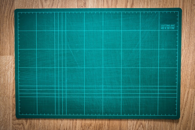 Cutting mats on the wood background