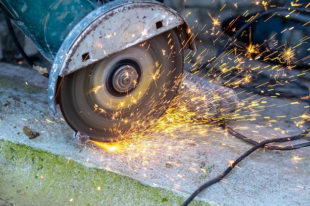 Cutting metal with a grinder. Sparks during metal cutting