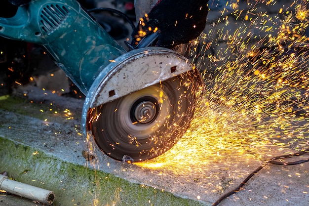 Cutting metal with a grinder. Sparks during metal cutting