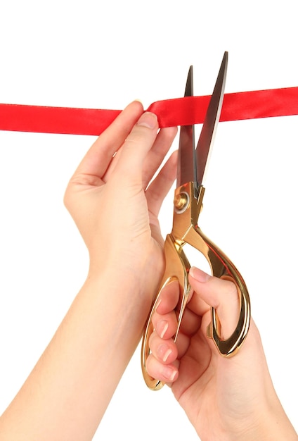 Cutting red ribbon isolated on white