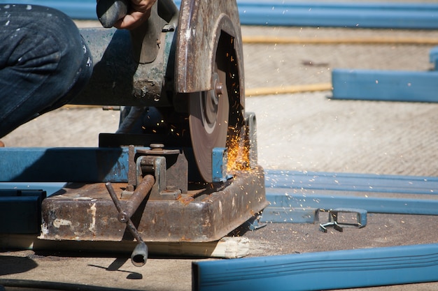 Cutting steel with angle grinder in reinforcing iron site