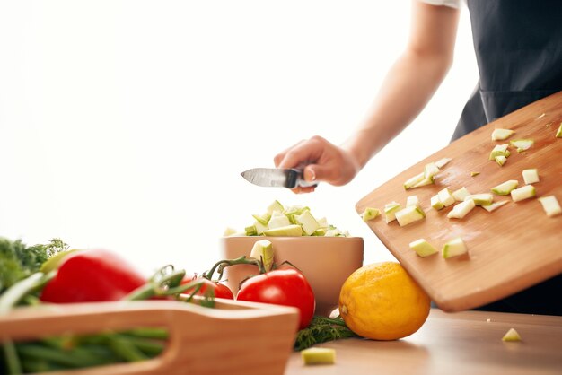 Cutting vegetables on a cutting board ingredients for salad\
fresh vegetables