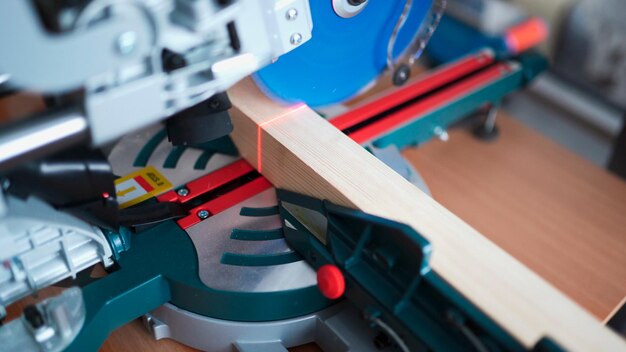 cutting wood with a miter saw. construction tool at work