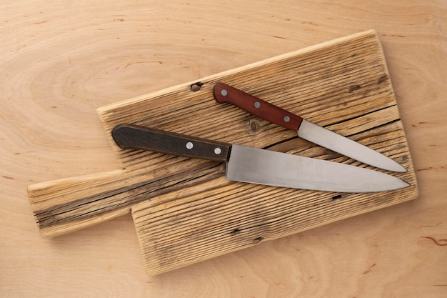 Photo cutting wooden board and kitchen knives