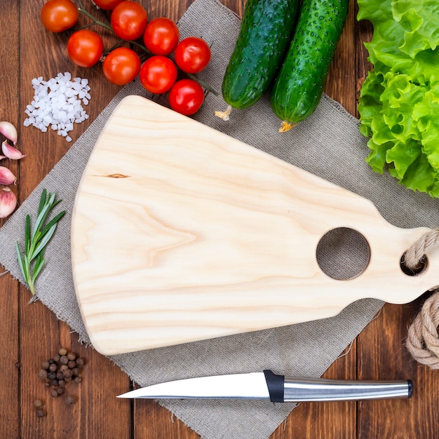 Photo cutting wooden board on a wooden table